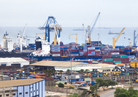 An overview image of a port full of cranes and containers.